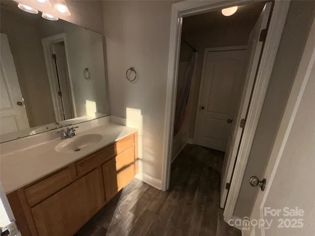a bathroom with a double vanity sink and mirror