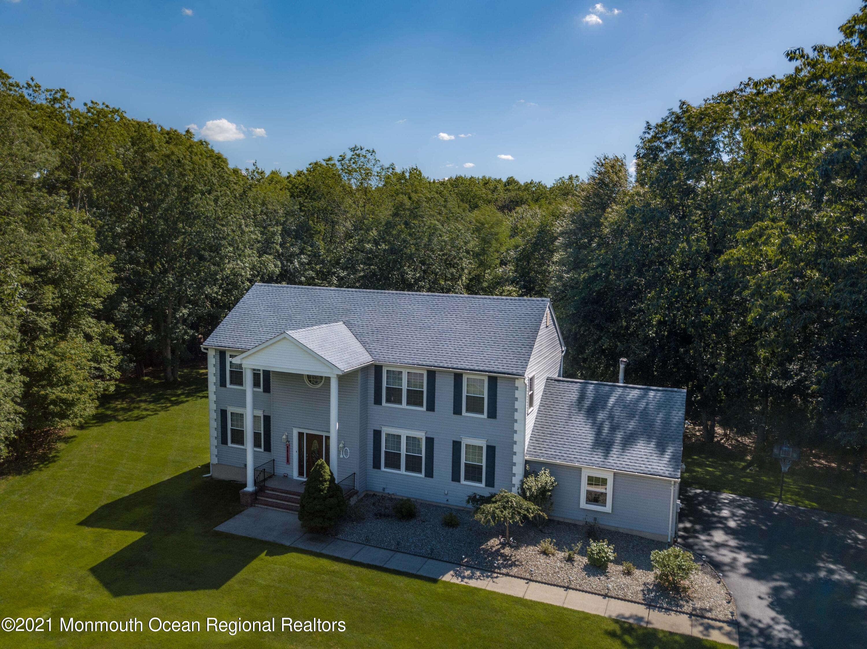 10 Rue Monet Jackson, NJ 08527 - Photo 3 of 30 an aerial view of a house with swimming pool a yard and a yard