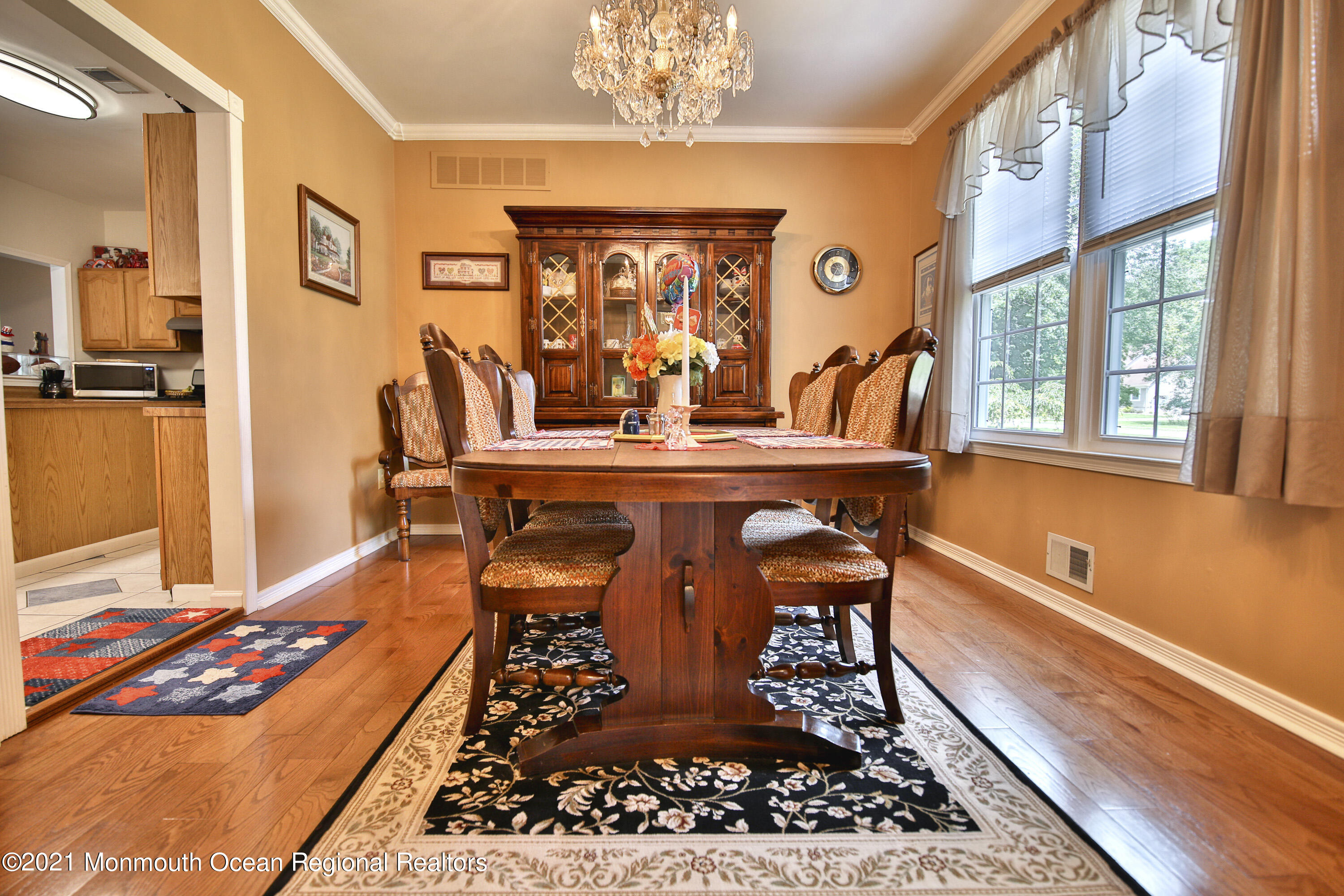 10 Rue Monet Jackson, NJ 08527 - Photo 10 of 30 a view of a dining room with furniture a chandelier and wooden floor