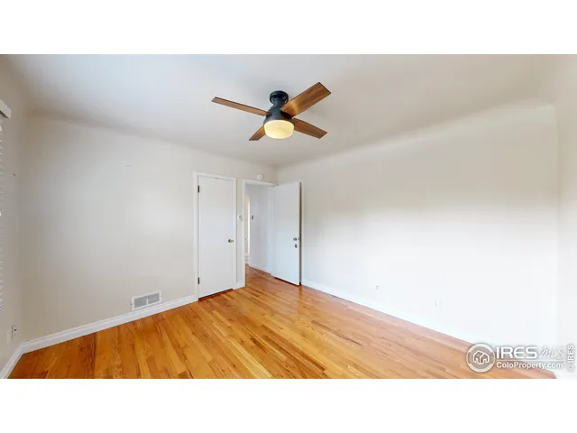 a open hall with a ceiling fan