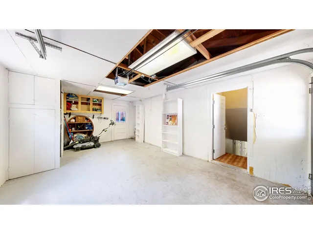 an aerial view of a house with a garden and yard