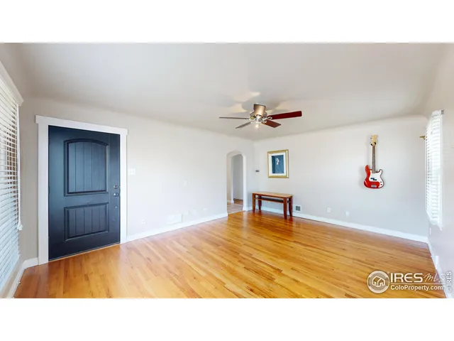 a room with a bed and a chandelier