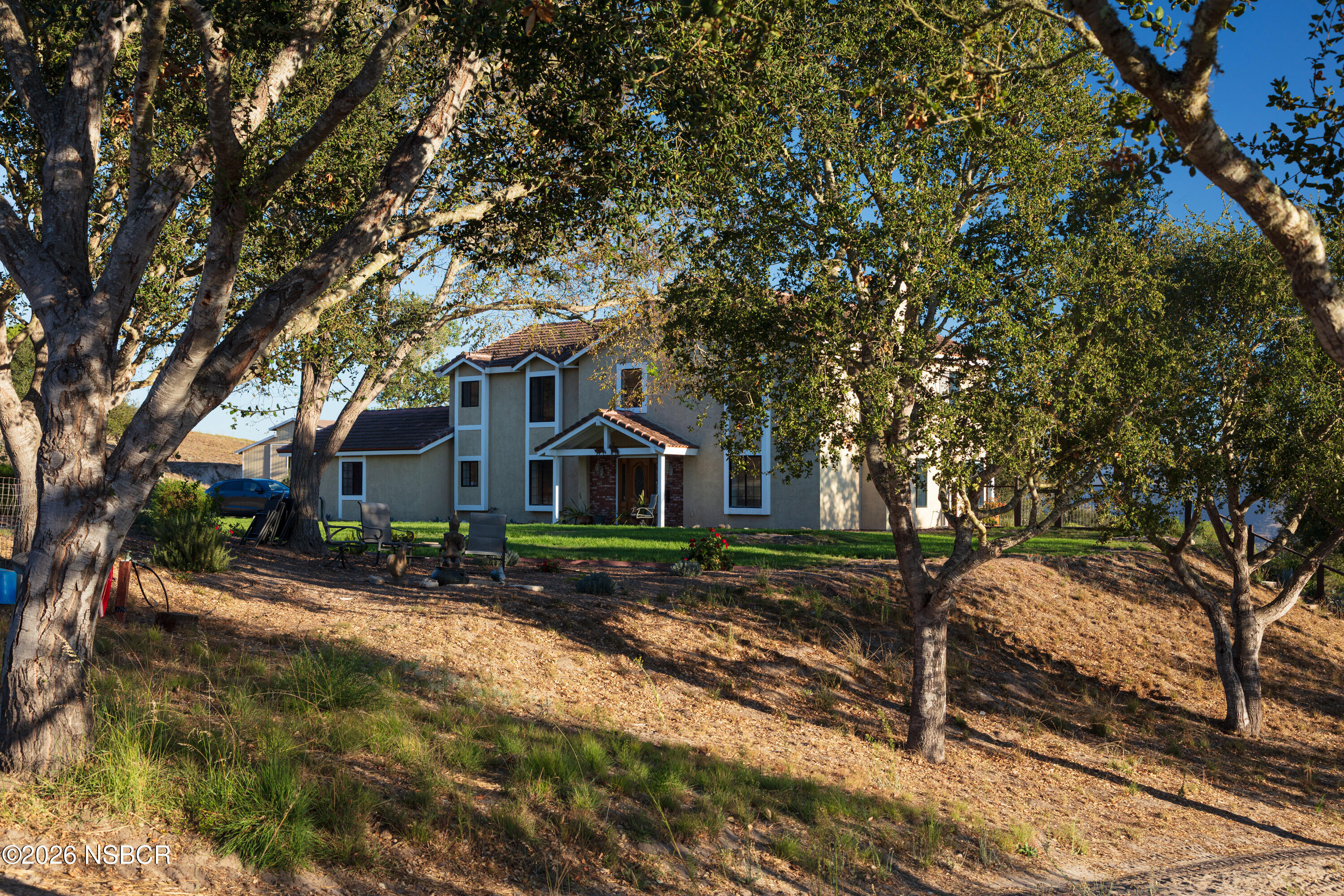1799 Cougar Ridge Road Buellton, CA 93427 - Photo 36 of 56 Front of House through Oak Trees