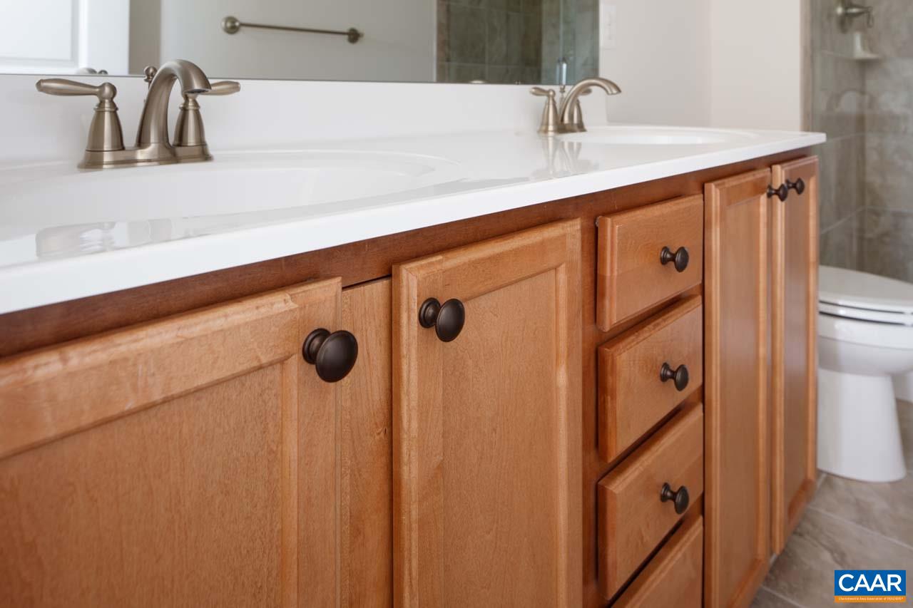 431 Rolkin Road Charlottesville, VA 22911 - Photo 11 of 26 a bathroom with a sink and mirror