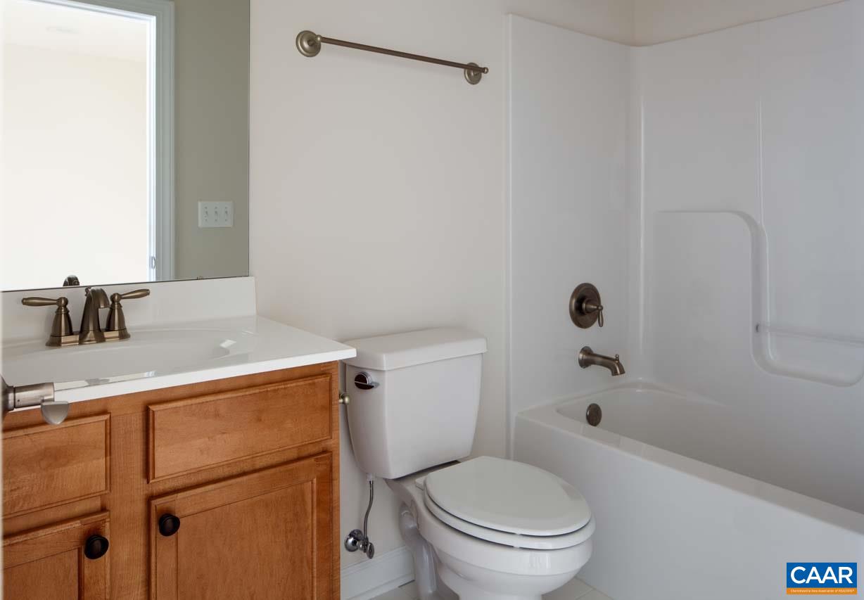 431 Rolkin Road Charlottesville, VA 22911 - Photo 17 of 26 a white toilet sitting next to a bathroom sink