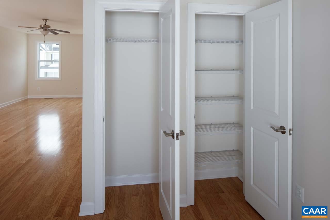 431 Rolkin Road Charlottesville, VA 22911 - Photo 5 of 26 a view of a hallway with wooden floor and closet area