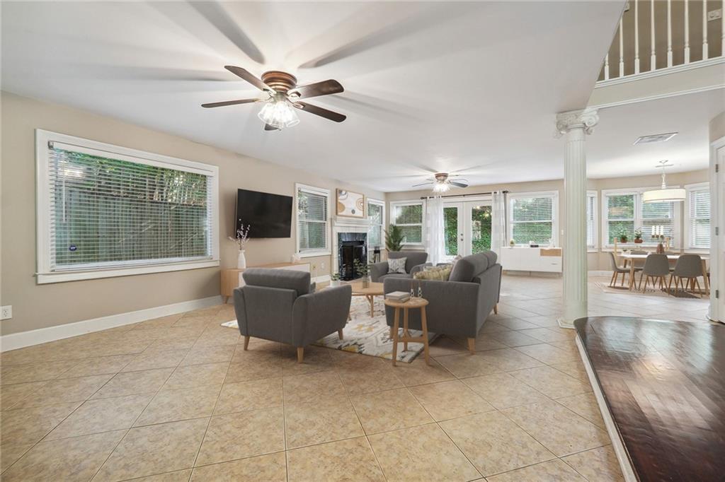 515 Spring Gate Lane Alpharetta, GA 30009 - Photo 2 of 36 a living room with furniture and a flat screen tv