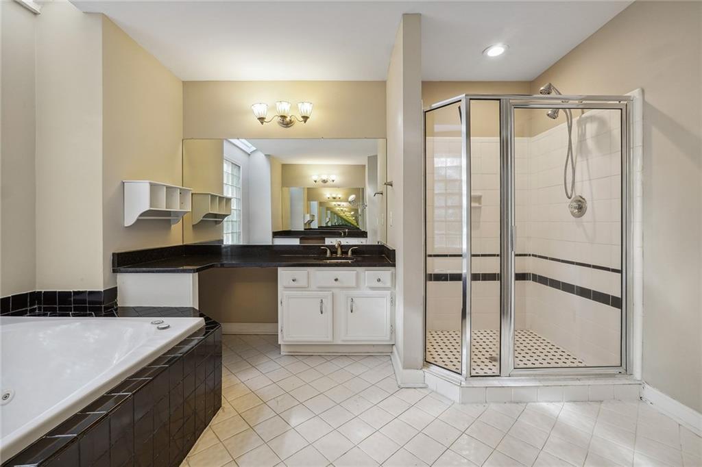 515 Spring Gate Lane Alpharetta, GA 30009 - Photo 21 of 36 a bathroom with a granite countertop sink mirror and