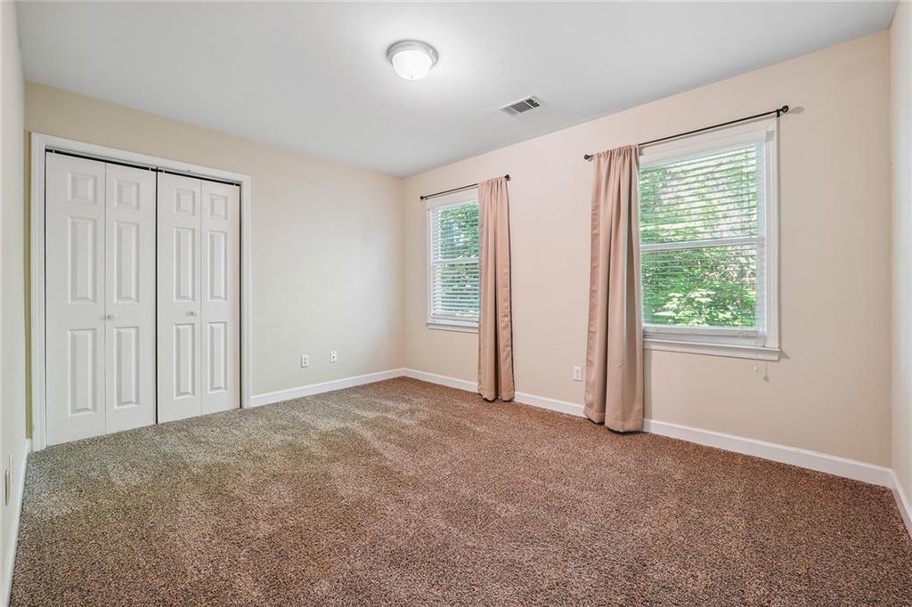 515 Spring Gate Lane Alpharetta, GA 30009 - Photo 26 of 36 an empty room with windows