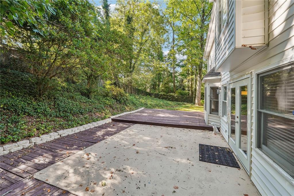 515 Spring Gate Lane Alpharetta, GA 30009 - Photo 27 of 36 a view of a pathway with a yard