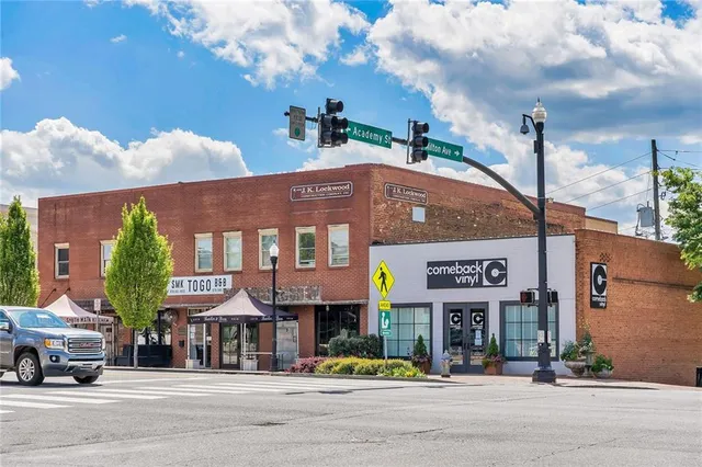 a view of a building with sitting area