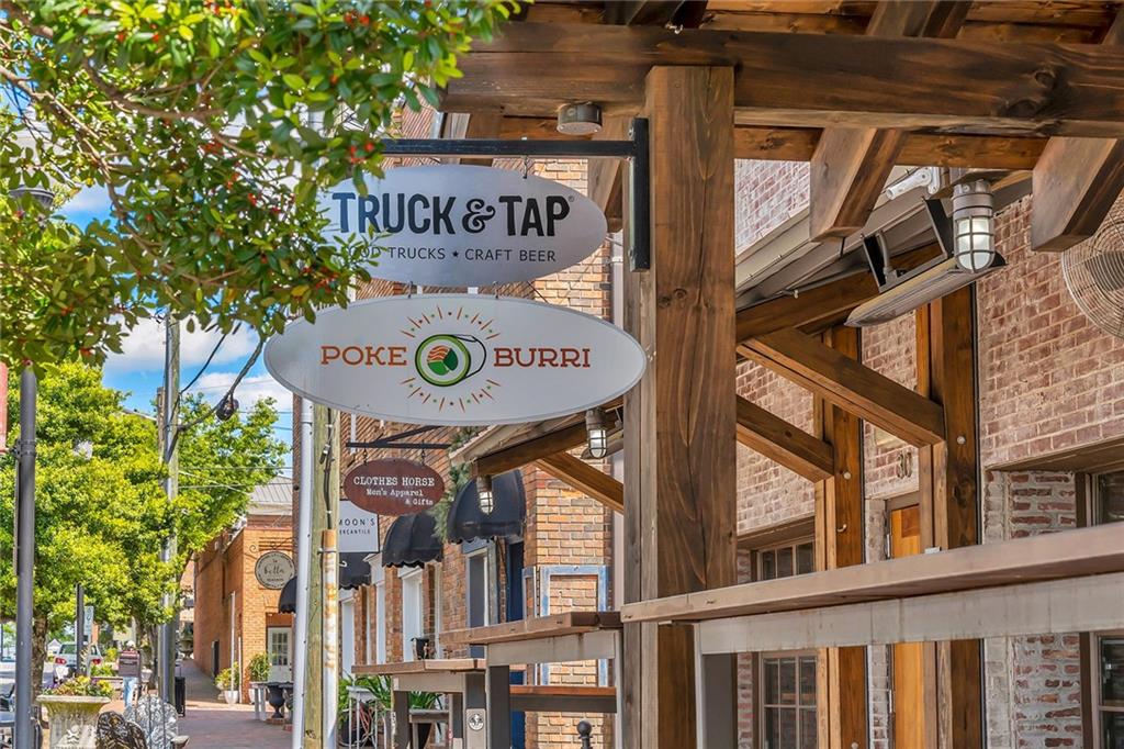 515 Spring Gate Lane Alpharetta, GA 30009 - Photo 34 of 36 a view of a street with stores