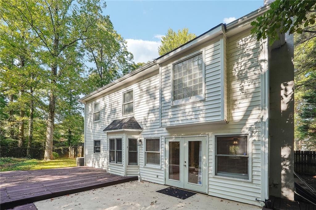 515 Spring Gate Lane Alpharetta, GA 30009 - Photo 5 of 36 a view of a house with a yard