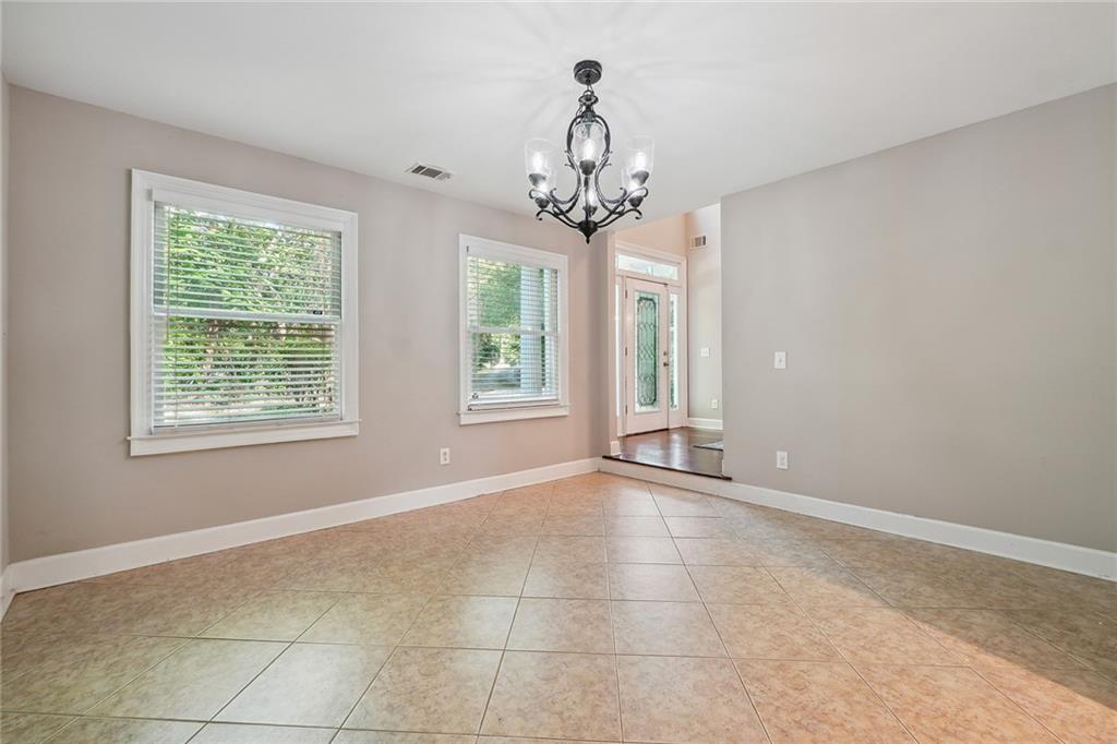 515 Spring Gate Lane Alpharetta, GA 30009 - Photo 9 of 36 a view of an empty room with a window