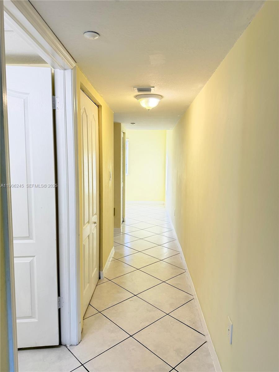 12635 Southwest 91st Street, Unit 211 Miami, FL 33186 - Photo 14 of 16 a view of a hallway