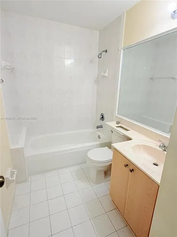 a bathroom with a sink a toilet and bathtub