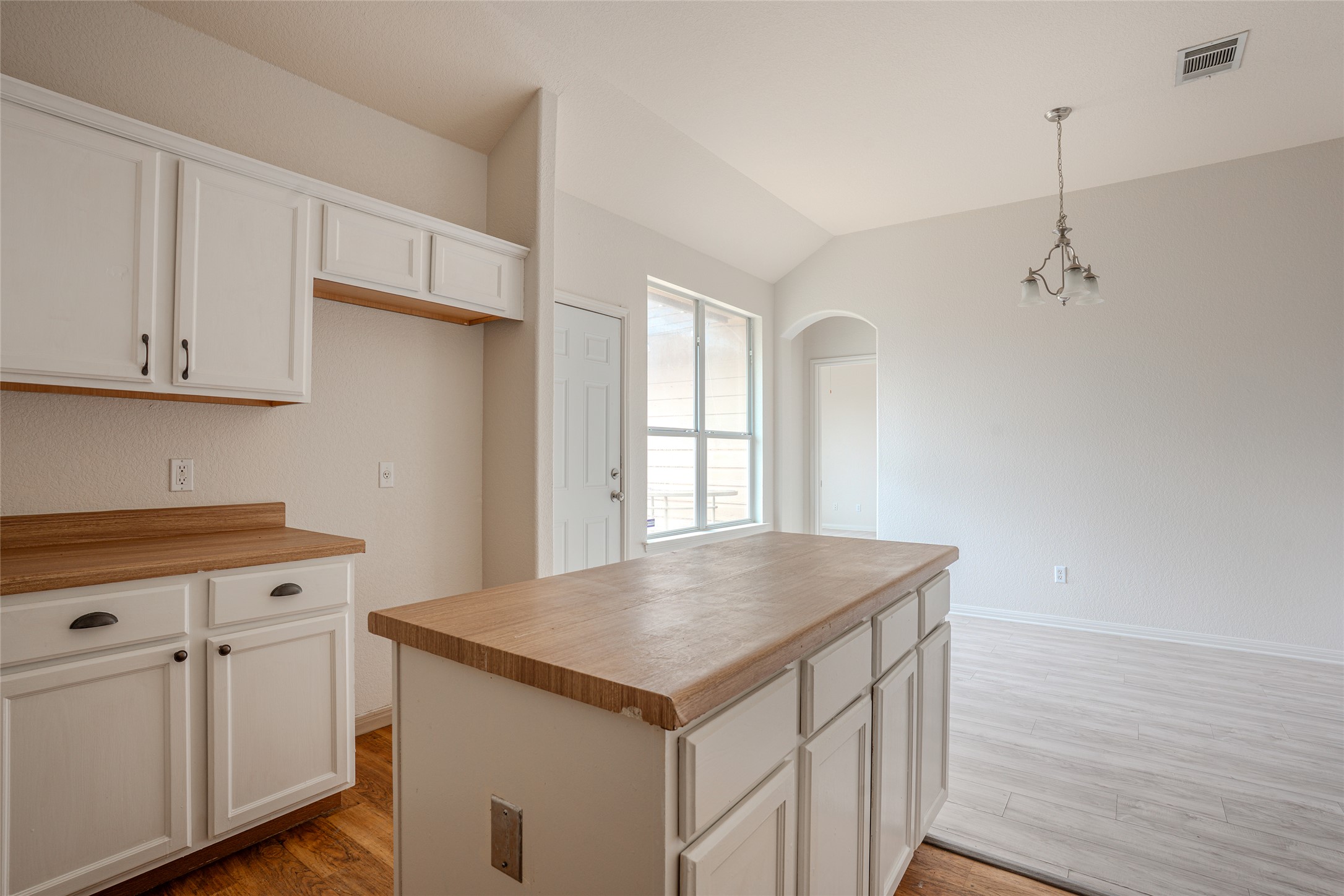 140 Dropper Kyle, TX 78640 - Photo 14 of 30 a kitchen with appliances cabinets and wooden floor