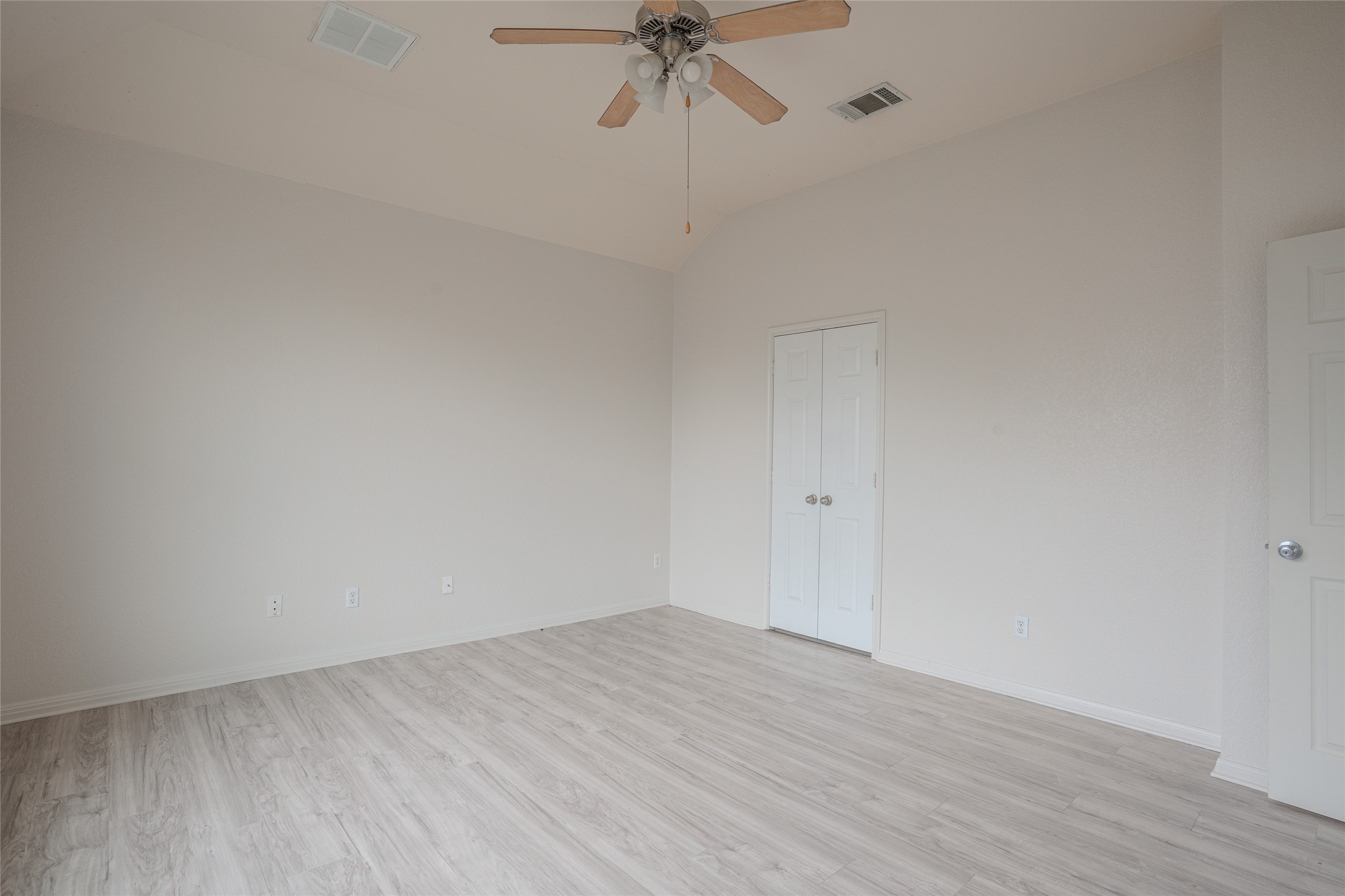 140 Dropper Kyle, TX 78640 - Photo 16 of 30 a view of a room with wooden floor and a ceiling fan