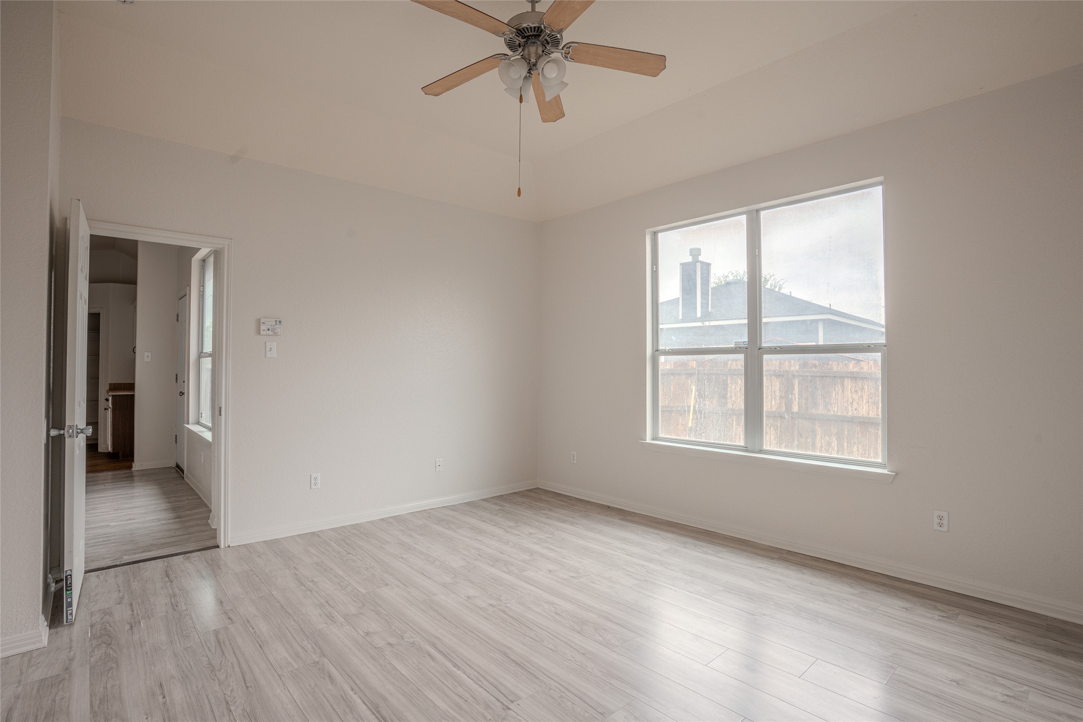 140 Dropper Kyle, TX 78640 - Photo 18 of 30 an empty room with fan and windows