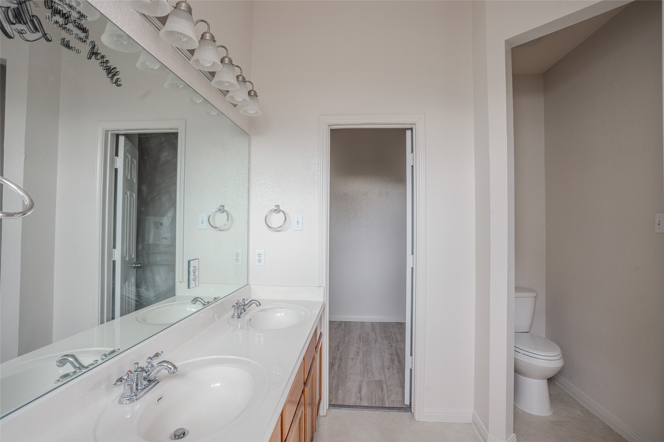 140 Dropper Kyle, TX 78640 - Photo 20 of 30 a bathroom with a granite countertop sink a toilet and shower