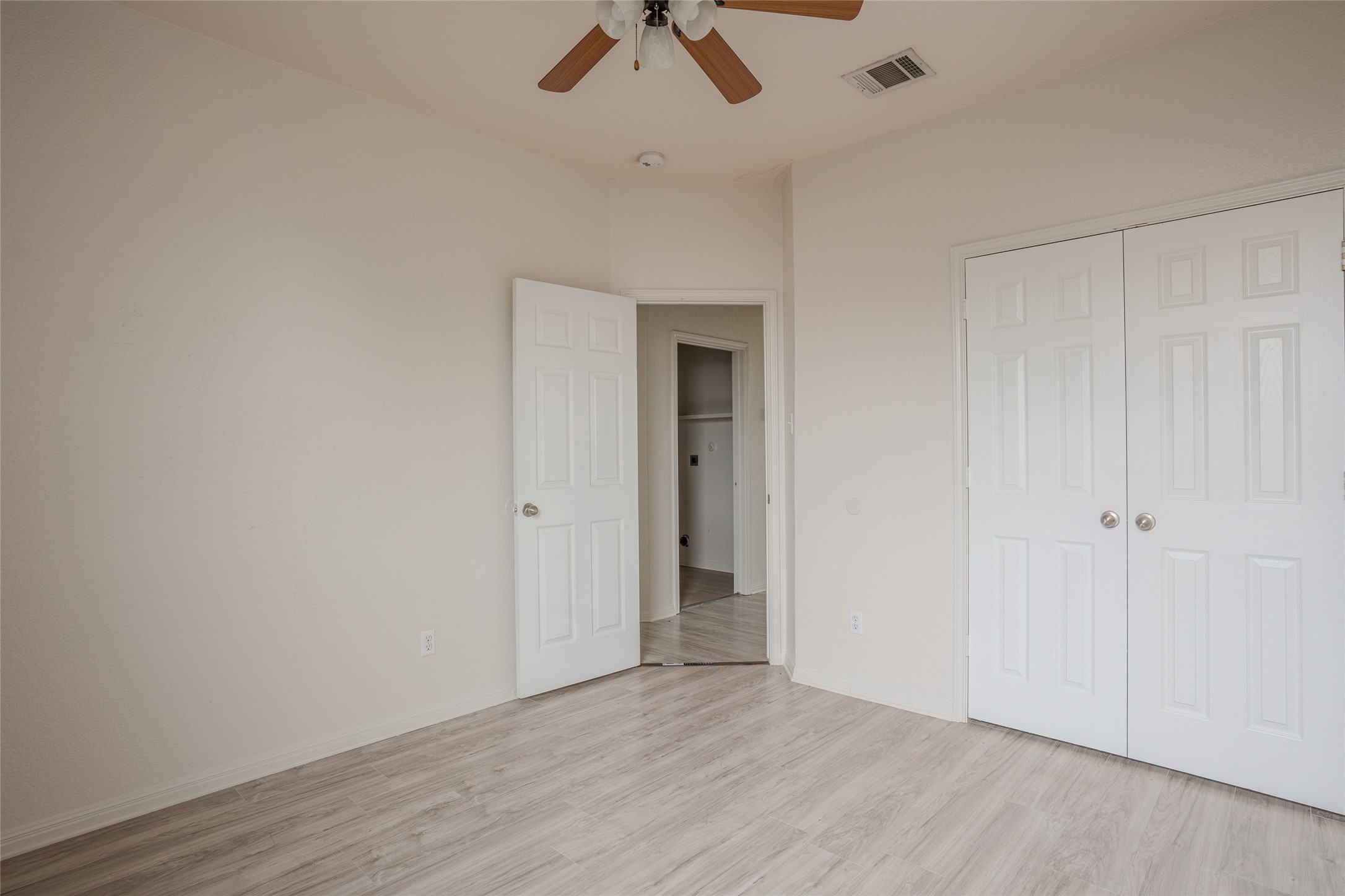 140 Dropper Kyle, TX 78640 - Photo 24 of 30 wooden floor in an empty room