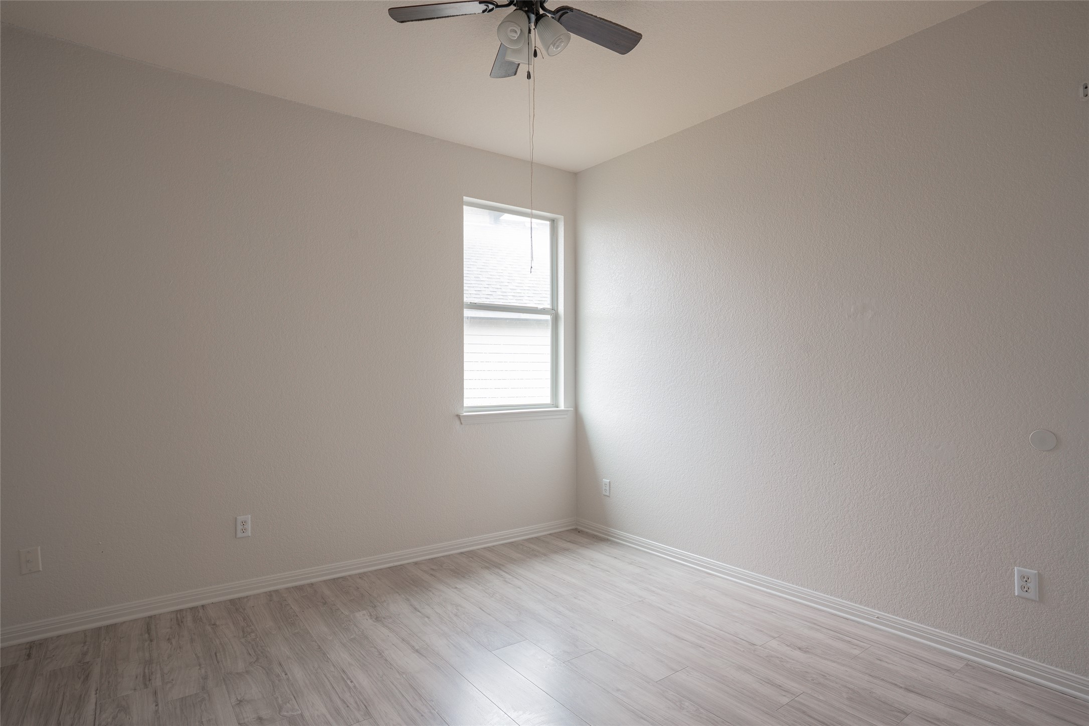 140 Dropper Kyle, TX 78640 - Photo 26 of 30 an empty room with a window and a fan