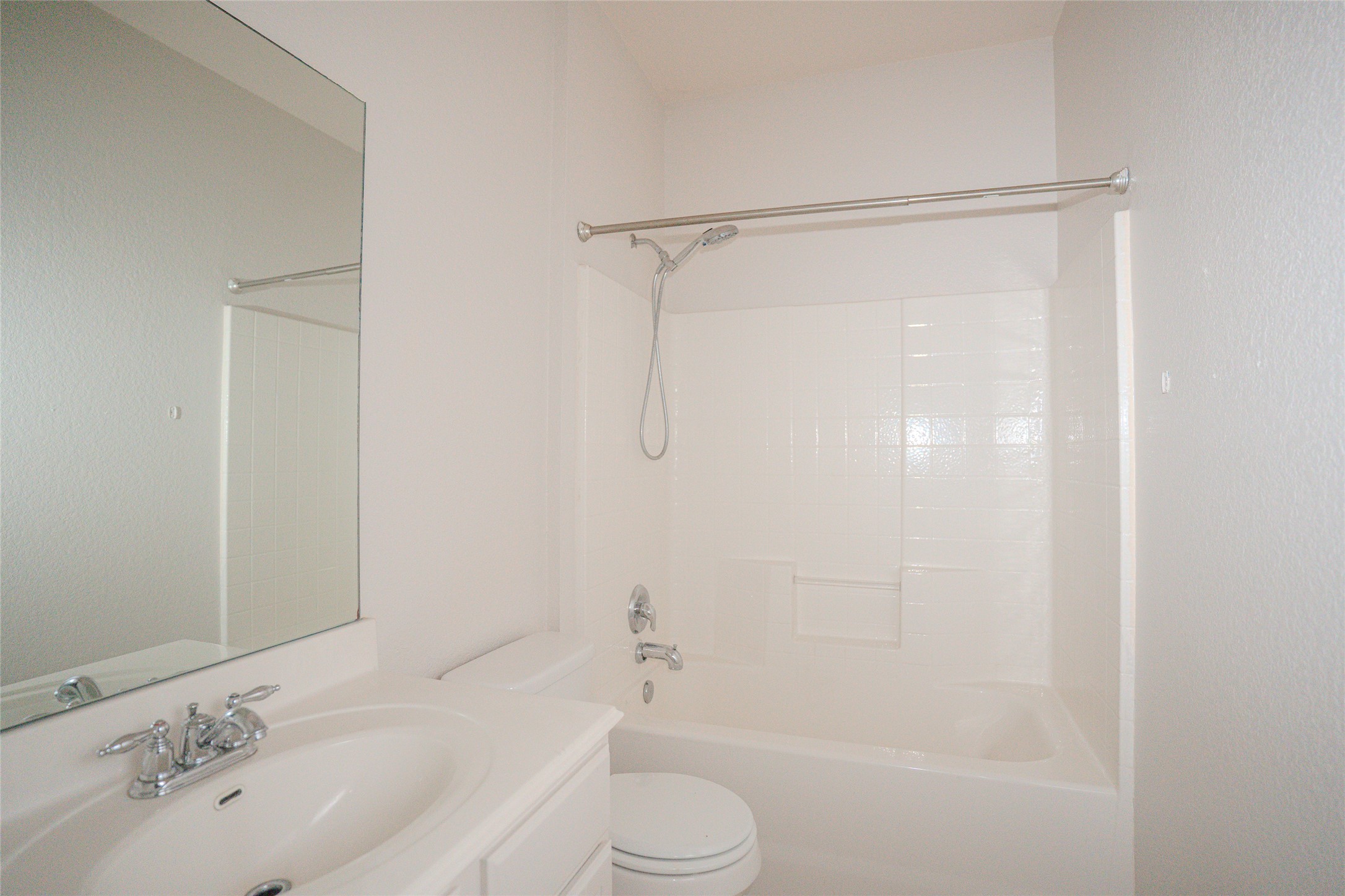 140 Dropper Kyle, TX 78640 - Photo 29 of 30 a bathroom with a bathtub shower sink vanity and toilet
