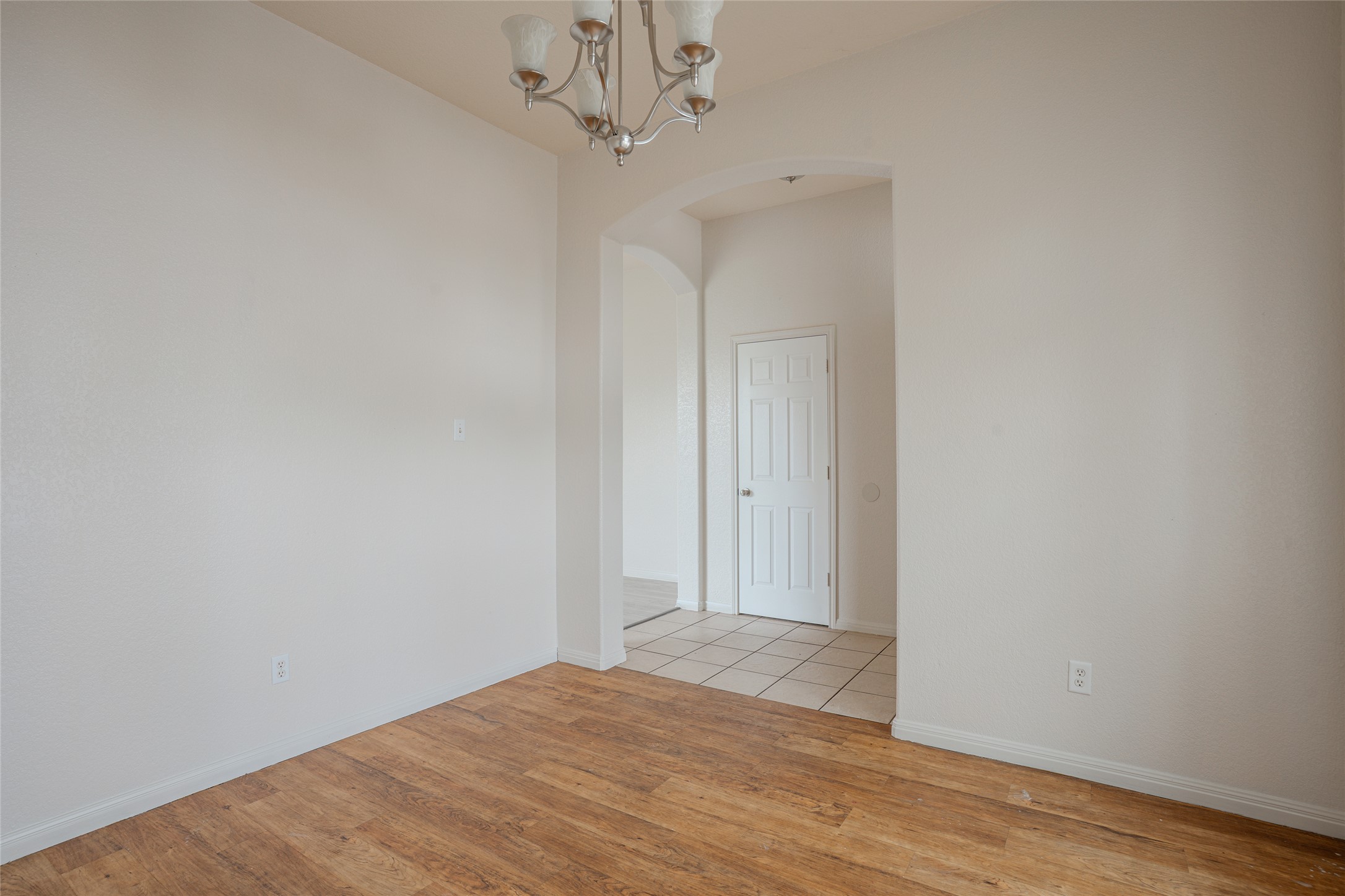 140 Dropper Kyle, TX 78640 - Photo 9 of 30 a view of empty room with wooden floor and ceiling fan
