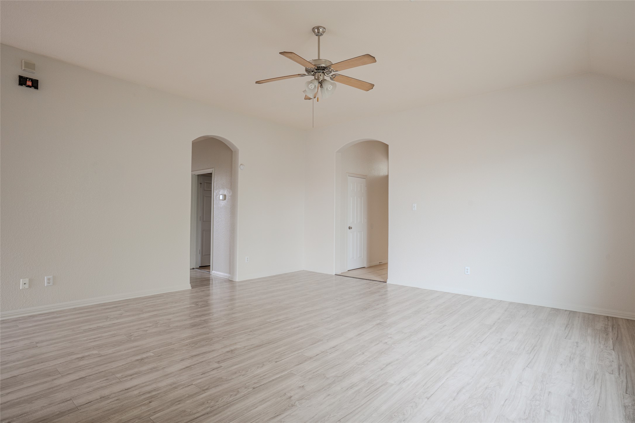 140 Dropper Kyle, TX 78640 - Photo 10 of 30 a view of an empty room with a window and wooden floor