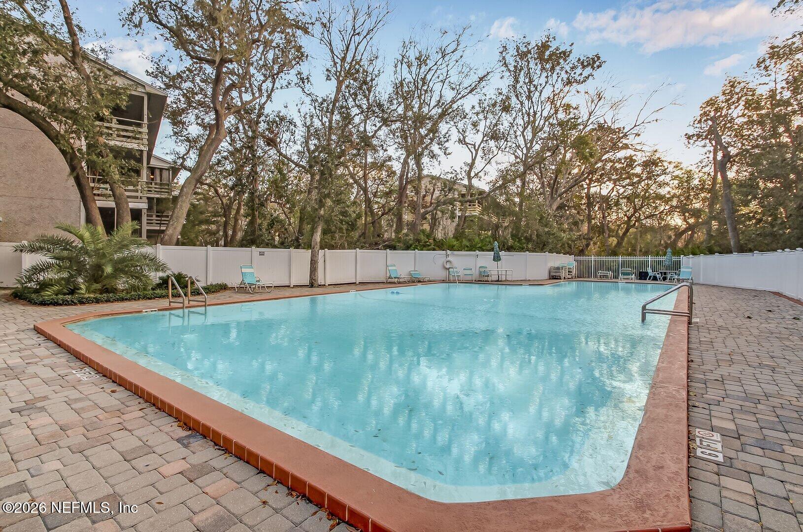 2328 Sadler Road, Unit 7D Fernandina Beach, FL 32034 - Photo 5 of 7 a view of a backyard with a tree