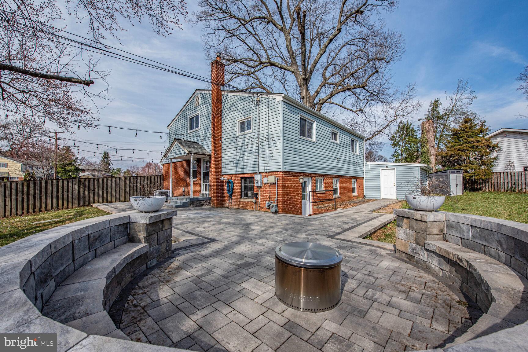 10321 Wood Road Fairfax, VA 22030 - Photo 47 of 55 Built in Bench around the Firepit