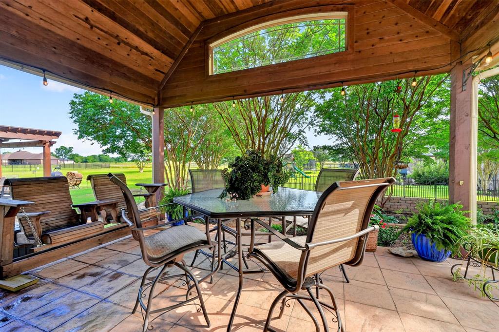 1399 Canyon Lake Road Wills Point, TX 75169 - Photo 28 of 37 a patio with yard glass top table and chairs