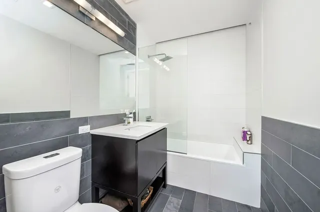 a bathroom with a sink a toilet and a bathtub