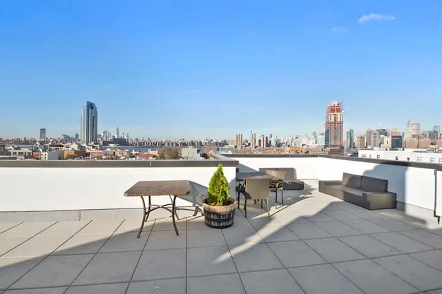 a view of roof deck with seating space