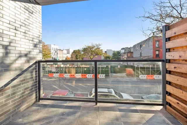 a view of a balcony with city view
