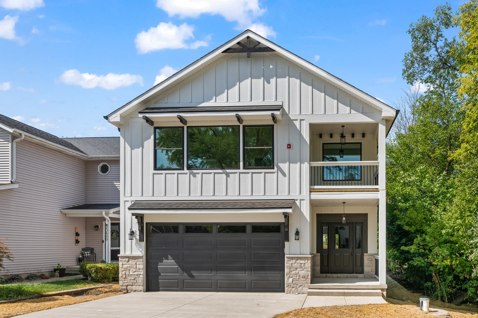 a front view of a house with a garage
