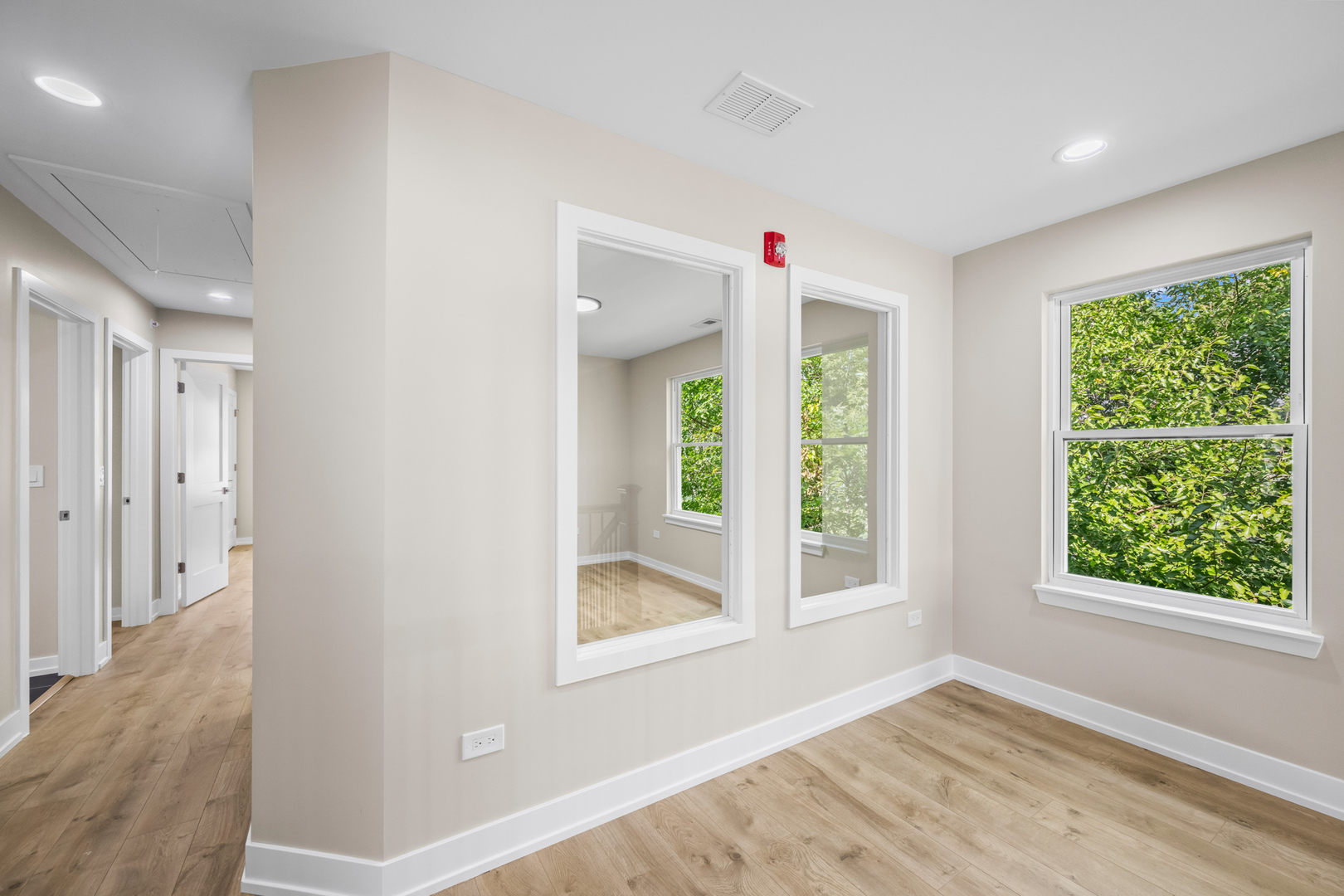 23612 North Field Road Lake Zurich, IL 60047 - Photo 9 of 16 a view of an empty room with wooden floor and a window