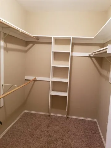 a view of an empty walk in closet