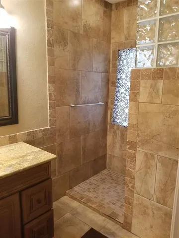 a bathroom with a sink and a shower