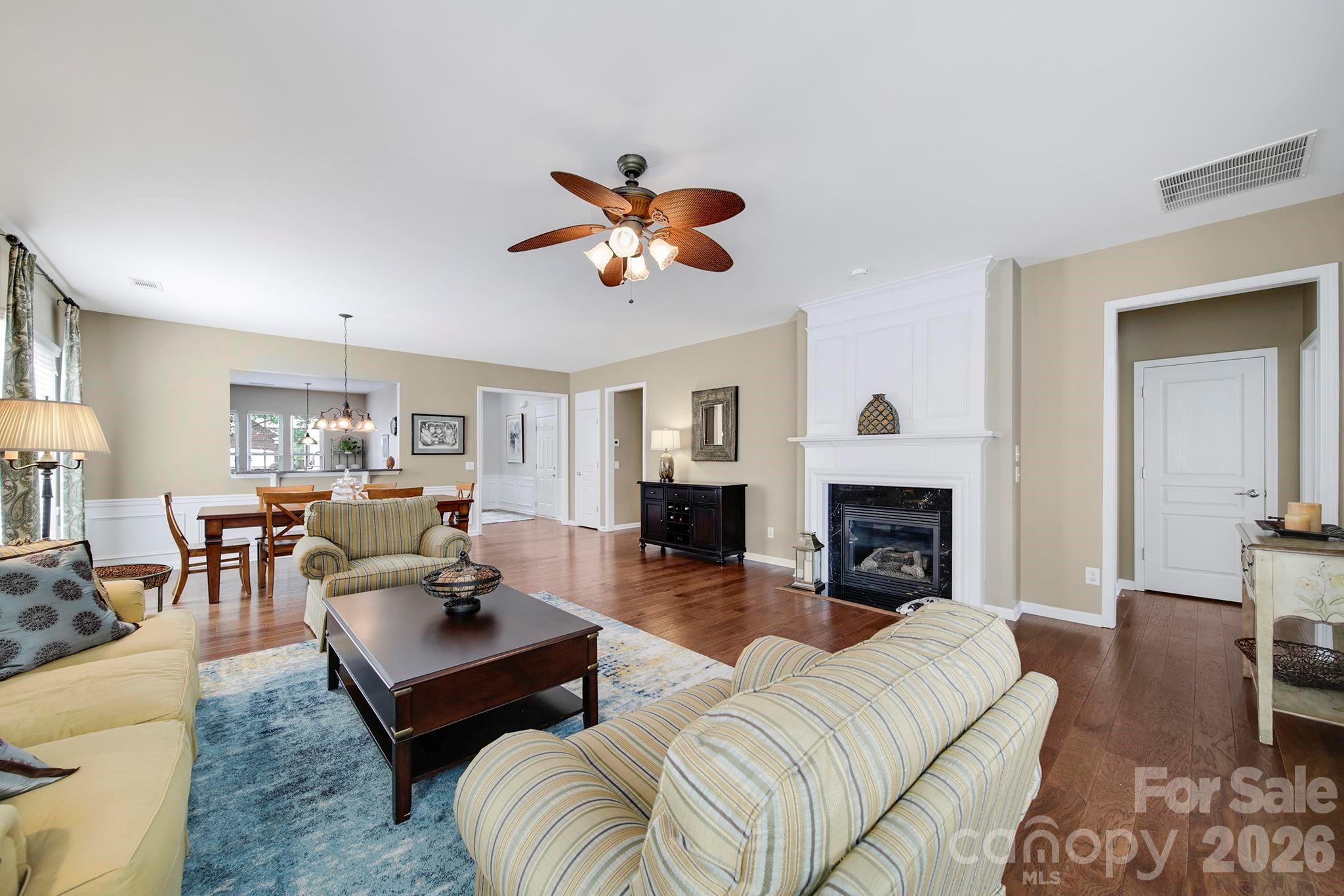 55414 Derringer Avenue Fort Mill, SC 29707 - Photo 12 of 45 a living room with furniture a fireplace and a table