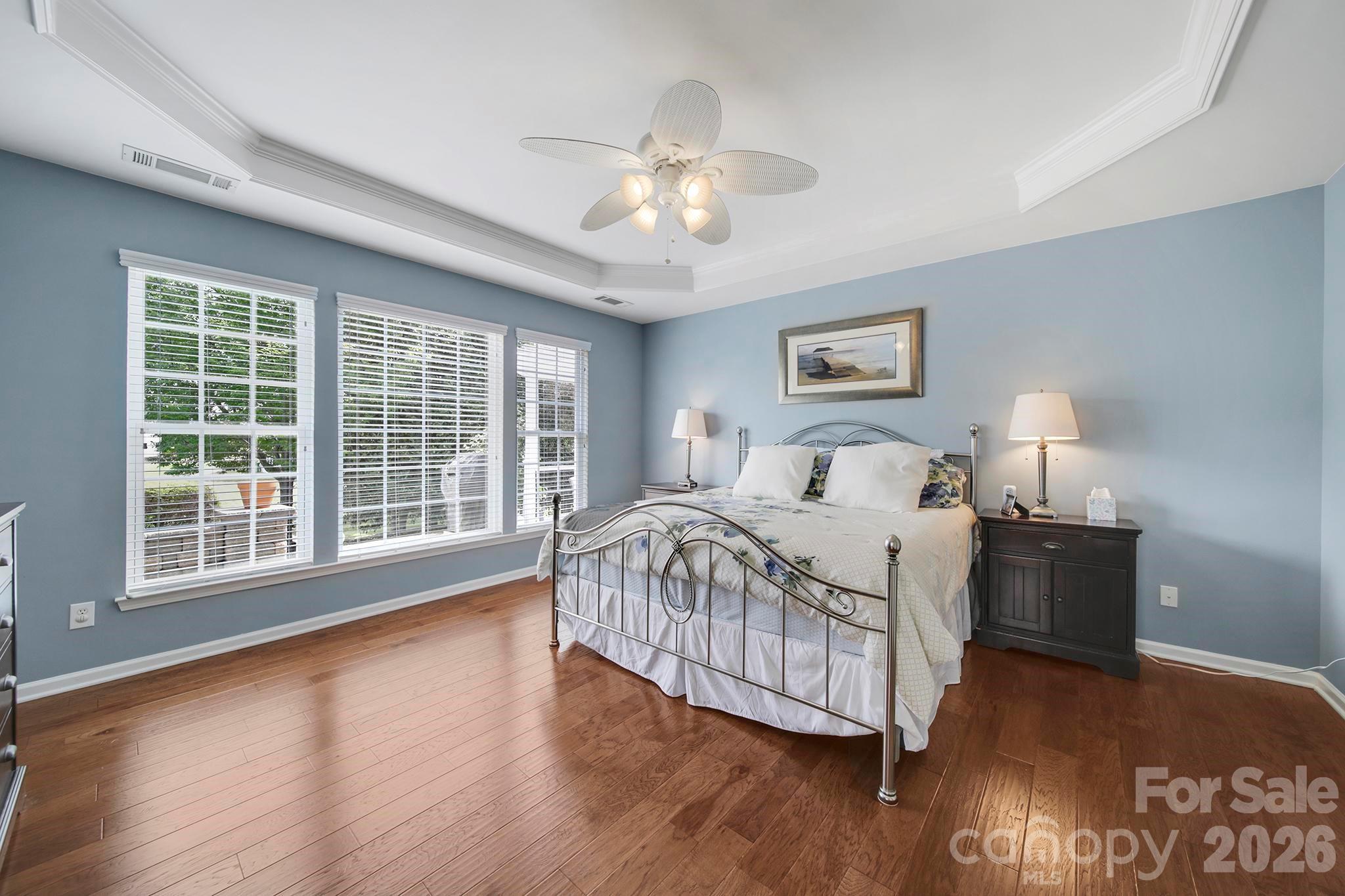 55414 Derringer Avenue Fort Mill, SC 29707 - Photo 17 of 45 a bedroom with a large bed and a large window