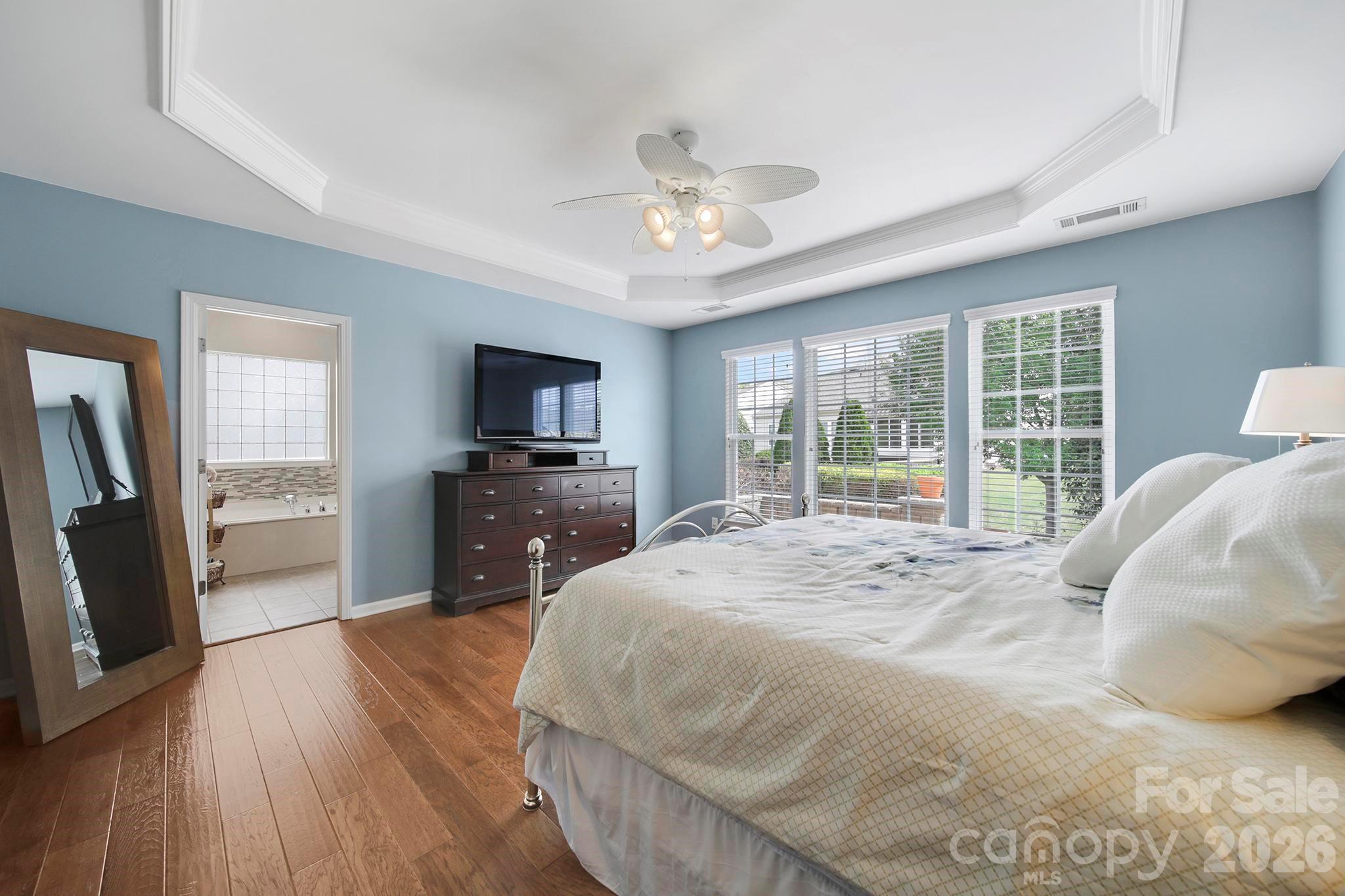 55414 Derringer Avenue Fort Mill, SC 29707 - Photo 18 of 45 a bedroom with a bed and a flat screen tv