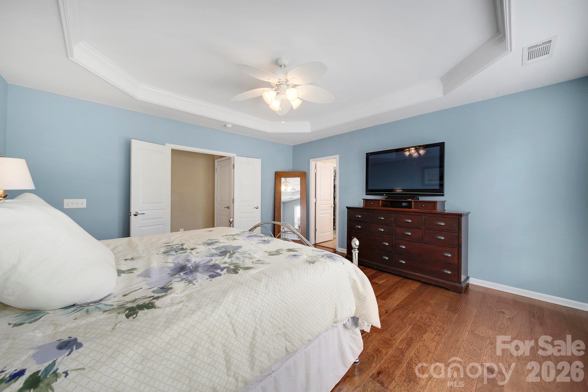 55414 Derringer Avenue Fort Mill, SC 29707 - Photo 19 of 45 a bedroom with a bed and a flat screen tv