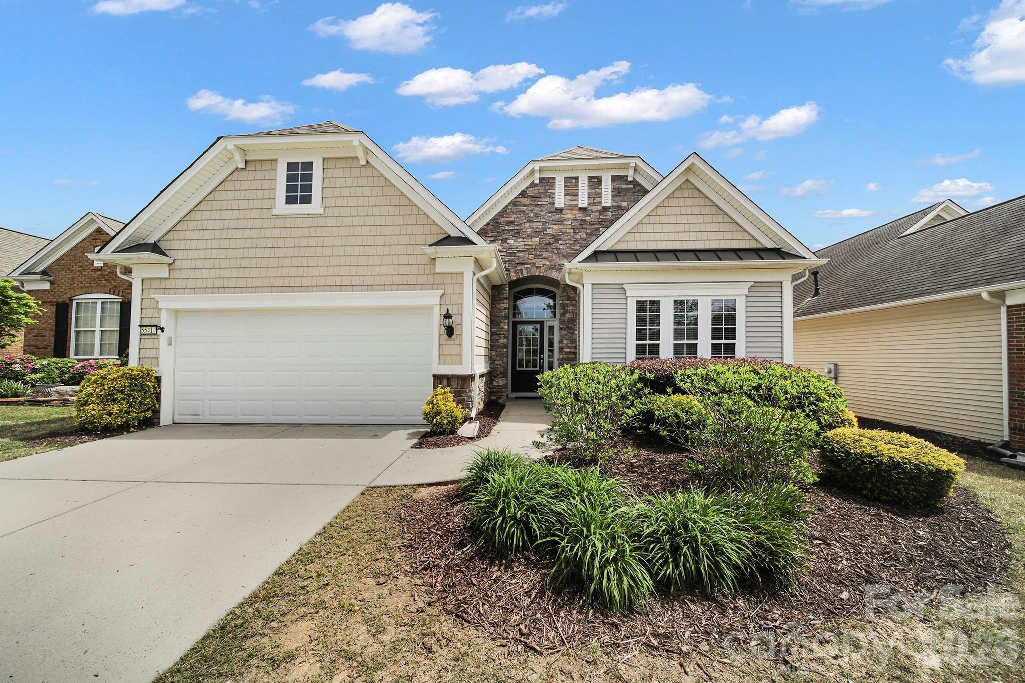 55414 Derringer Avenue Fort Mill, SC 29707 - Photo 2 of 45 a front view of a house with garden