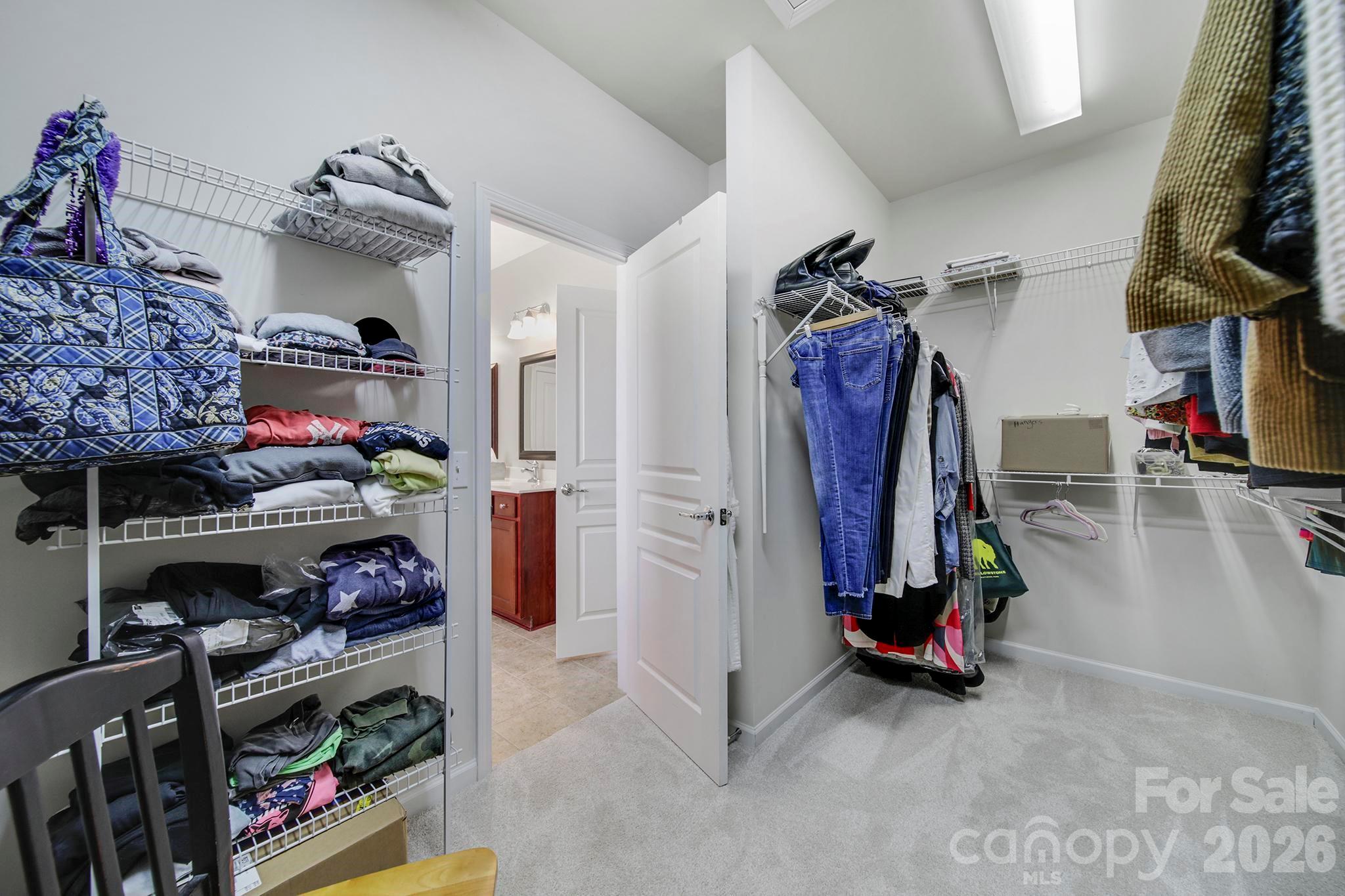 55414 Derringer Avenue Fort Mill, SC 29707 - Photo 22 of 45 a view of walk in closet with clothes and shoes