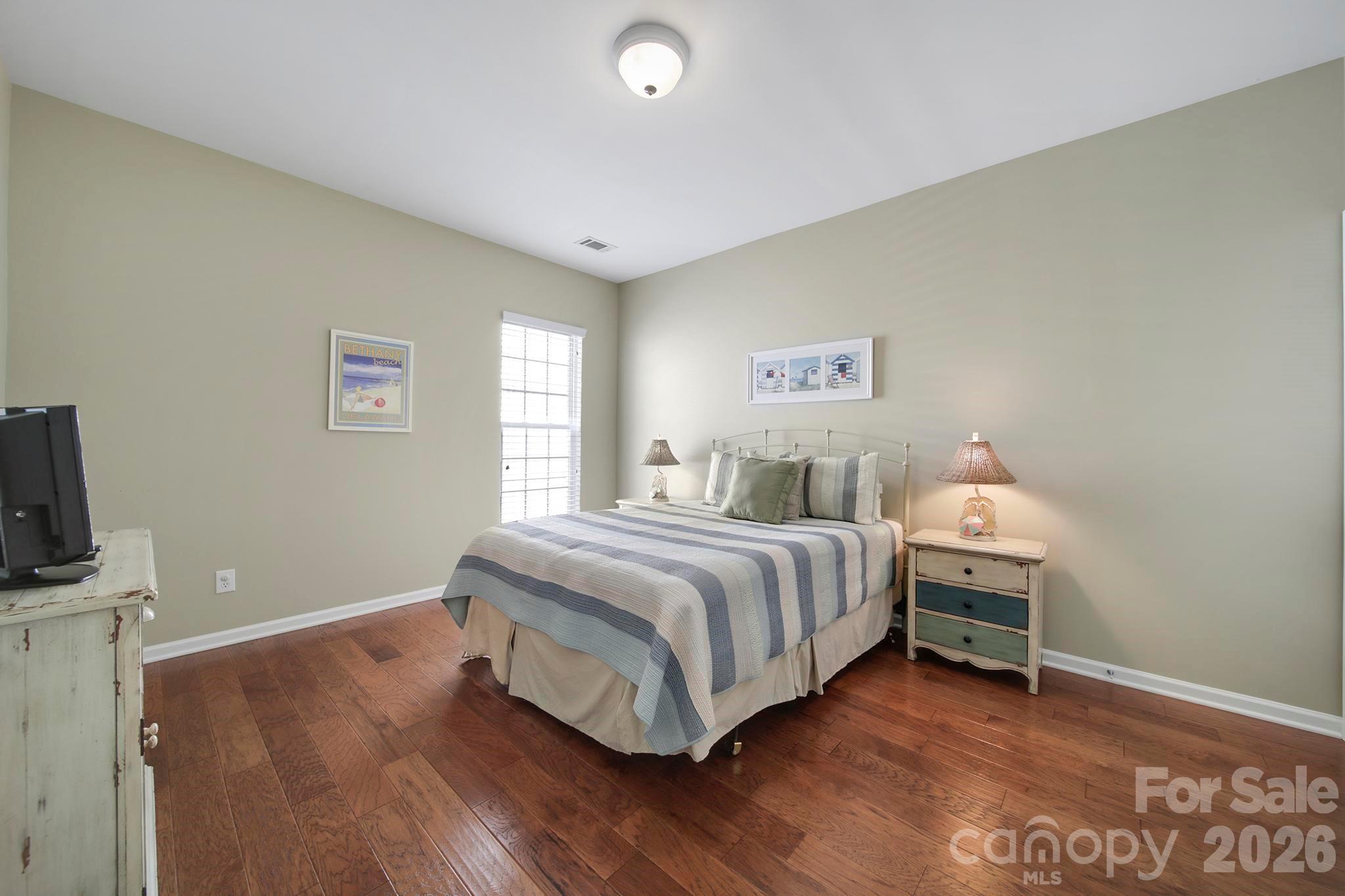 55414 Derringer Avenue Fort Mill, SC 29707 - Photo 23 of 45 a bedroom with a bed and a flat screen tv