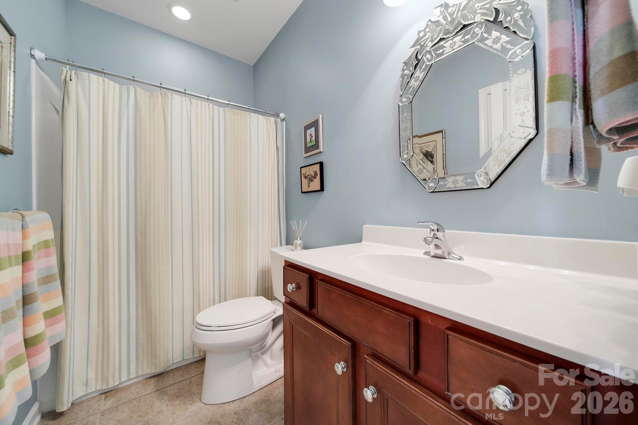 55414 Derringer Avenue Fort Mill, SC 29707 - Photo 25 of 45 a bathroom with a sink a toilet and mirror