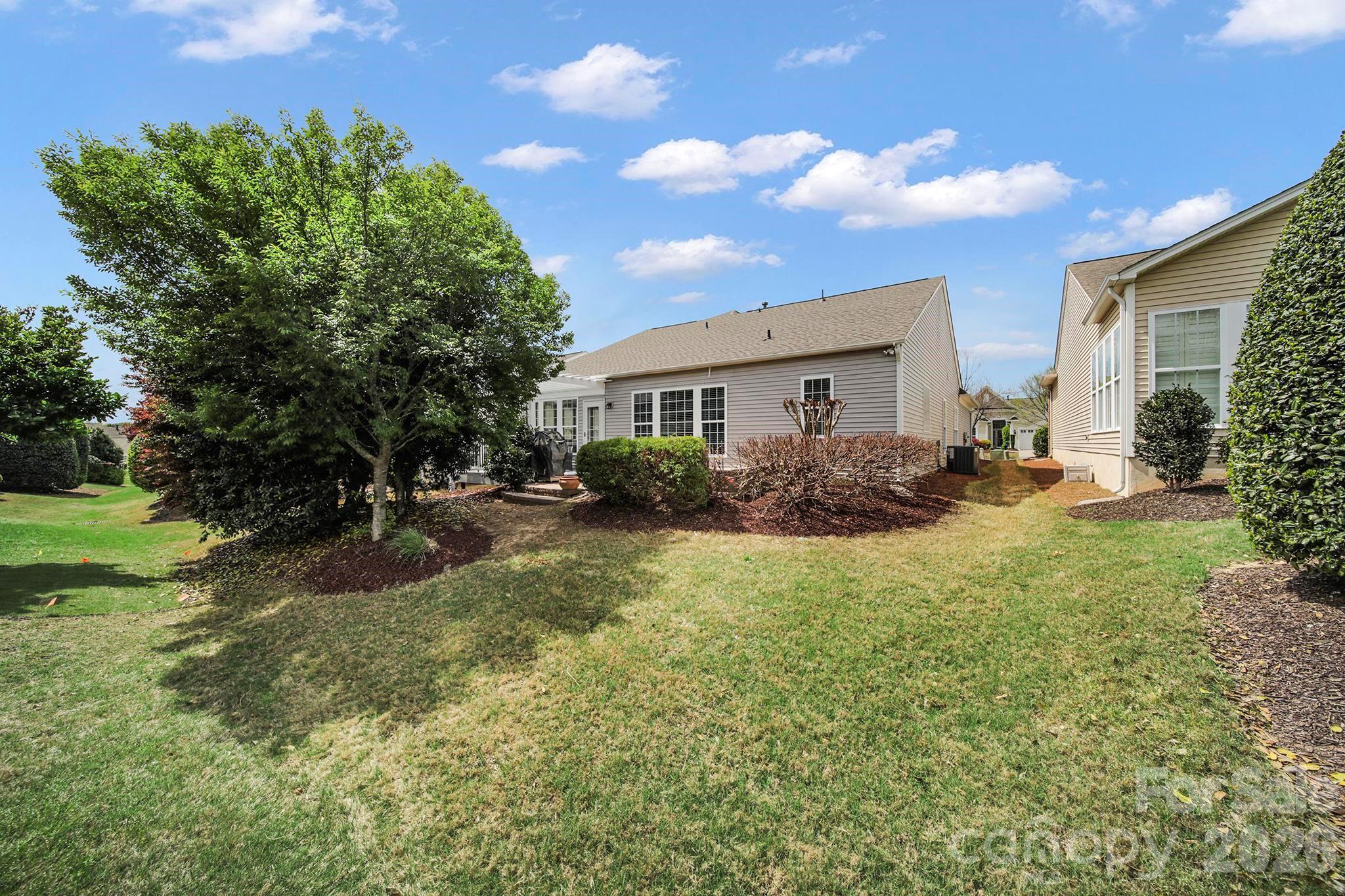 55414 Derringer Avenue Fort Mill, SC 29707 - Photo 34 of 45 a house view with swimming pool and garden