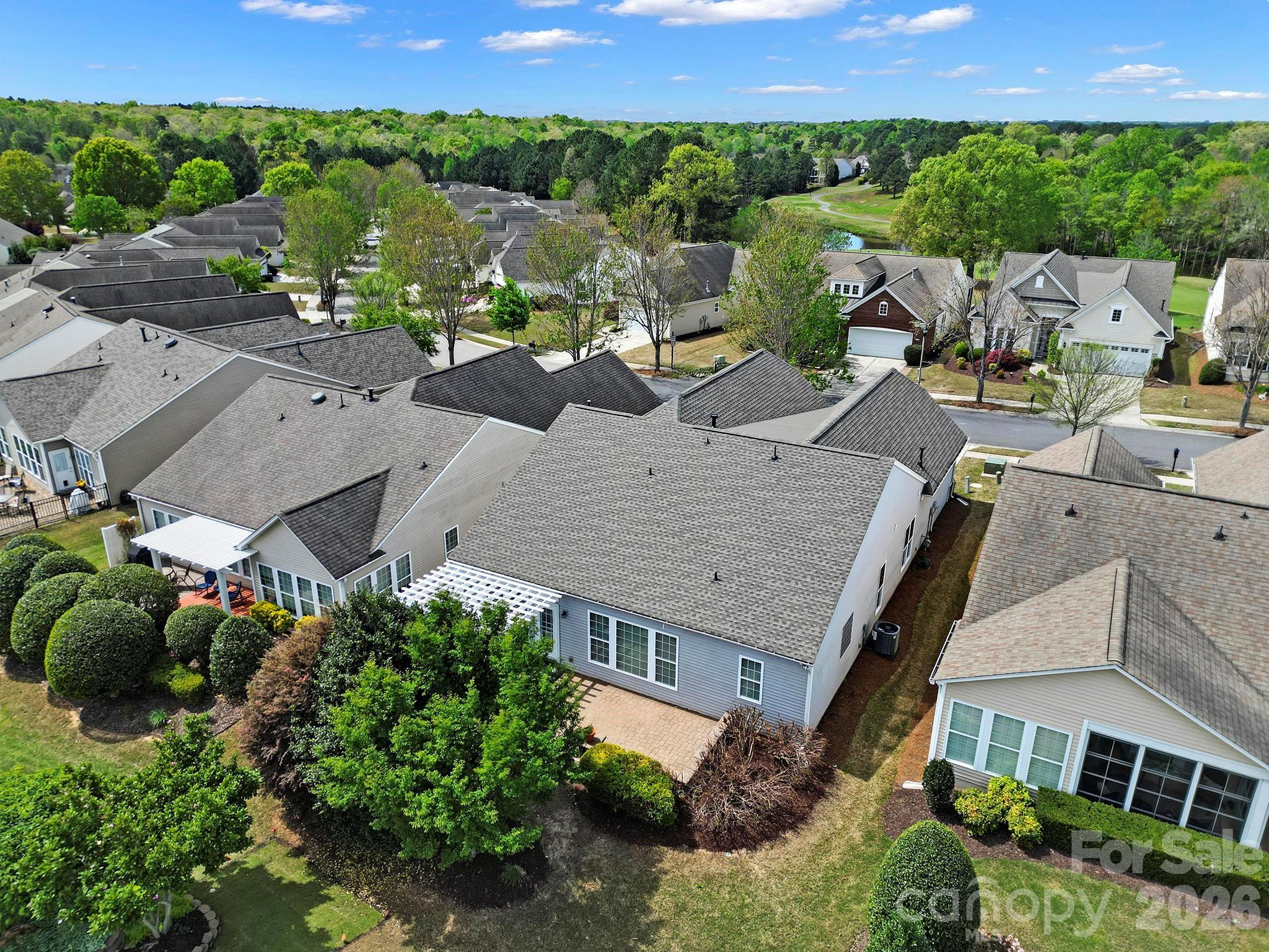 55414 Derringer Avenue Fort Mill, SC 29707 - Photo 35 of 45 an aerial view of multiple houses with a yard