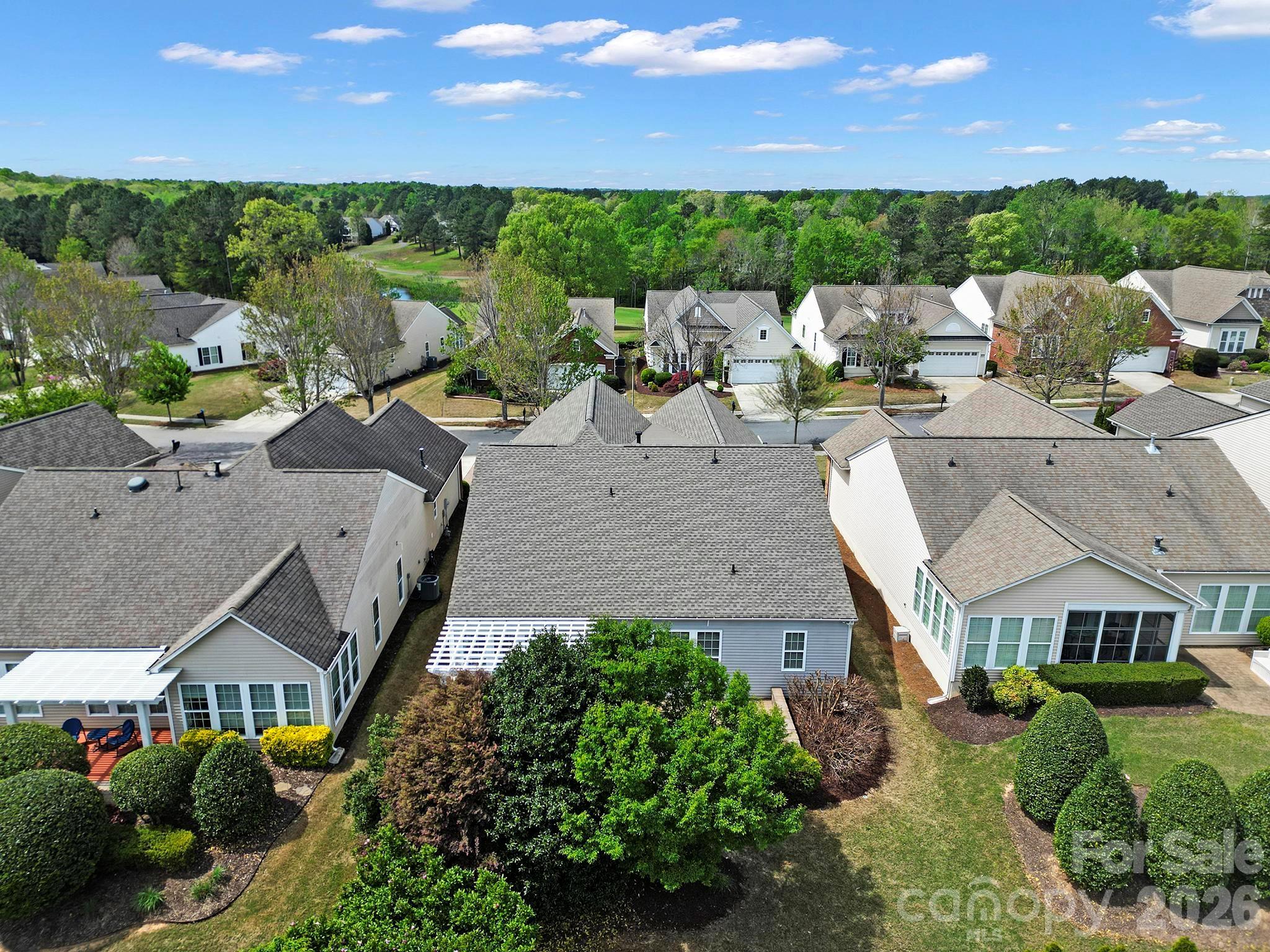 55414 Derringer Avenue Fort Mill, SC 29707 - Photo 36 of 45 an aerial view of a house with a yard basket ball court and outdoor seating